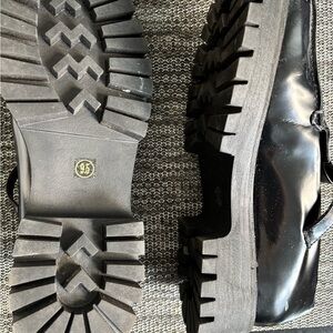 Steve Madden Glossy Black T strap loafers.